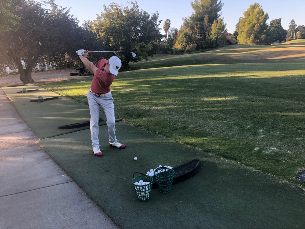Chico State golfer Kelley Sullivan takes some practice drives. Photo credit: Connor Mcpherson
