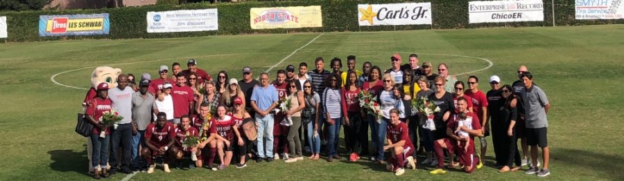 Chico State seniors and their families pose for a picture before the game against UC San Diego on Saturday. Photo credit: Connor Mcpherson