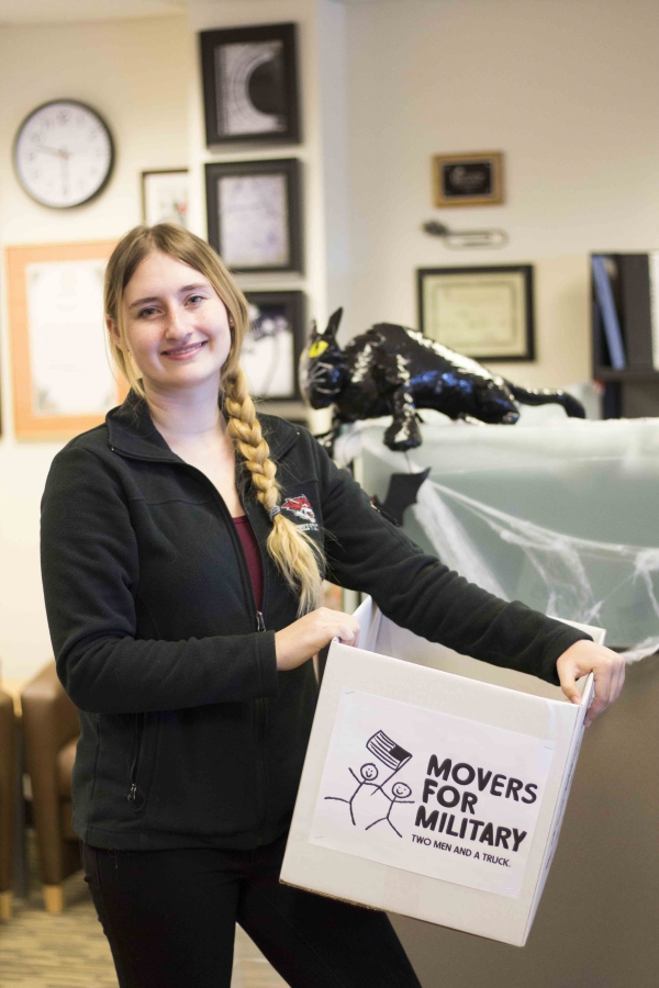 addison bedford holds a donation box located in chico state cave