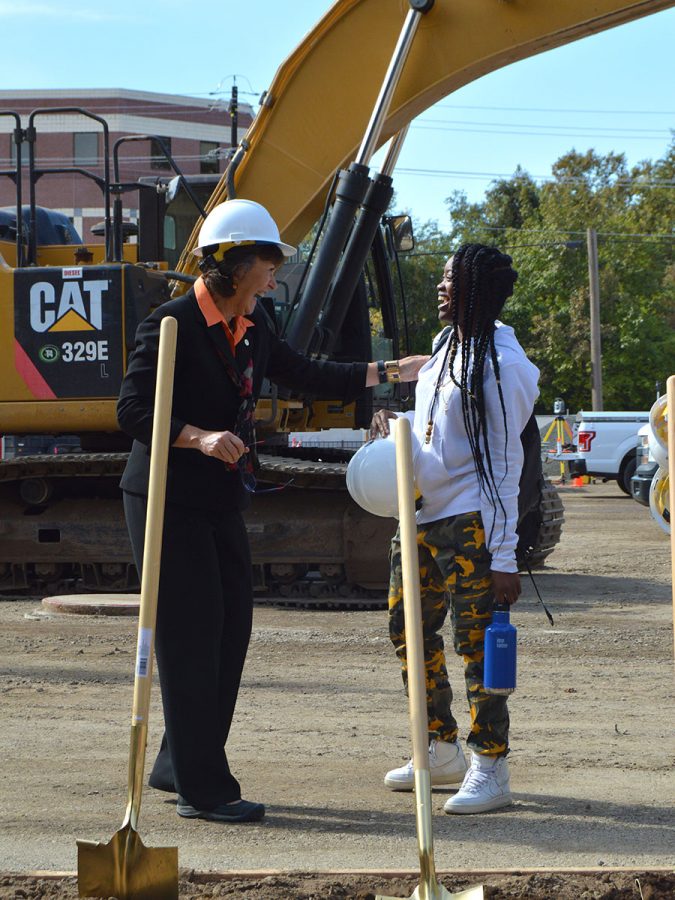 President Gayle Hutchinson and Marqia Smith share a moment of celebration of the new science building groundbreaking ceremony on Wednesday. Smith was walking by the ceremony when President Hutchinson invited her to grab the last shovel and hard hat and break ground for the new building alongside her. Photo credit: Olyvia Simpson