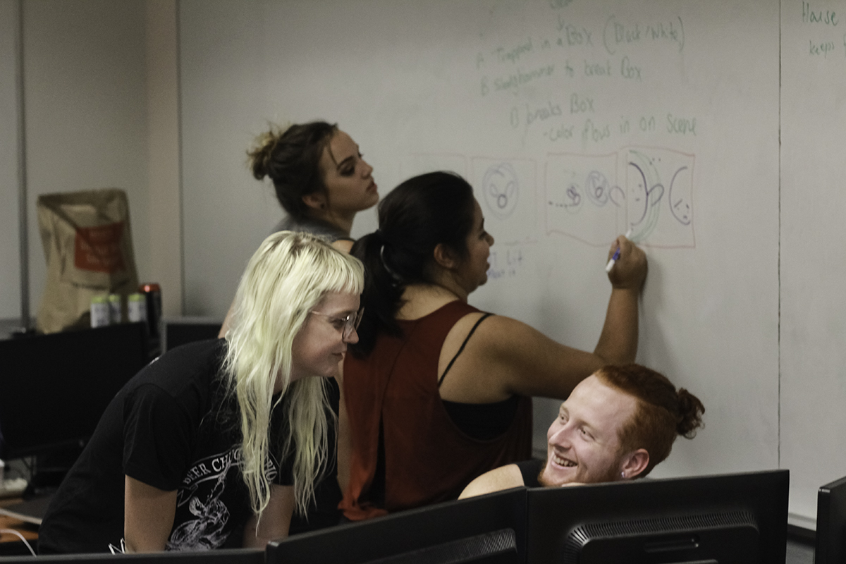 Sam, Nicole Martinez, Shannon Hanson, and Marissa Winslow create storyboards for their animation. Photo credit: Tara Killoran