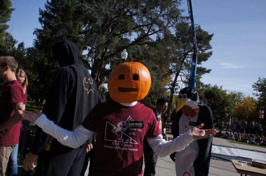 One+of+the+Chico+State+physics+students+wearing+a+pumpkin+on+his+head+during+the+annual+pumpkin+drop.+Photo+credit%3A+Keelie+Lewis