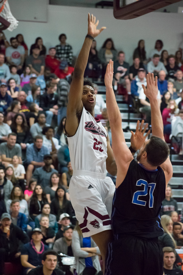 Sophomore Justin Briggs avoids defense and finds an open shot in a Chico's playoff matchup against Cal State San Bernardino last season in this archived image. Photo credit: Kate Angeles