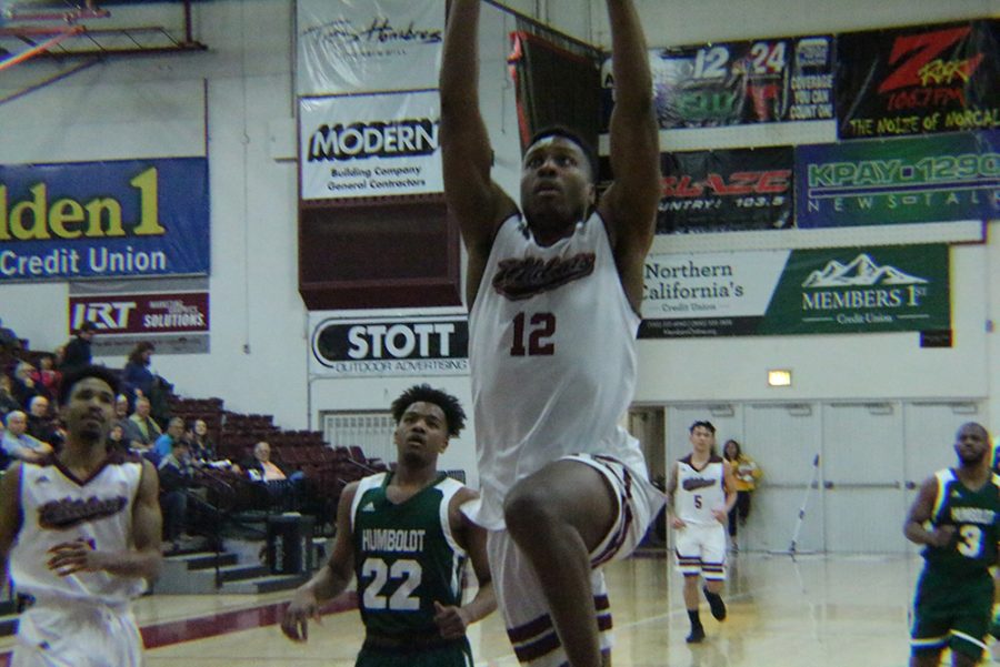 Marvin Timothy slams the ball in against Humboldt State Saturday night. Photo credit: Mathew Boe