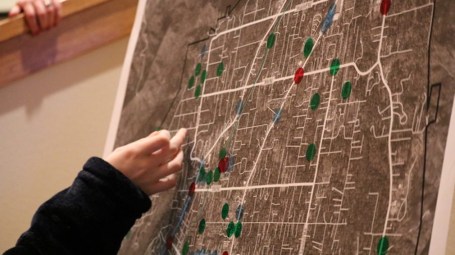Paradise locals gather into groups and each member take turns placing dots on the Paradise map. The dots signify the strengths, weaknesses, and opportunities, Friday, Feb. 22, 2019, in Paradise, CA. Photo credit: Melissa Herrera