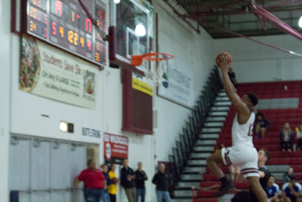 Marvin Timothy goes up for the slam. Photo credit: Mathew Boe