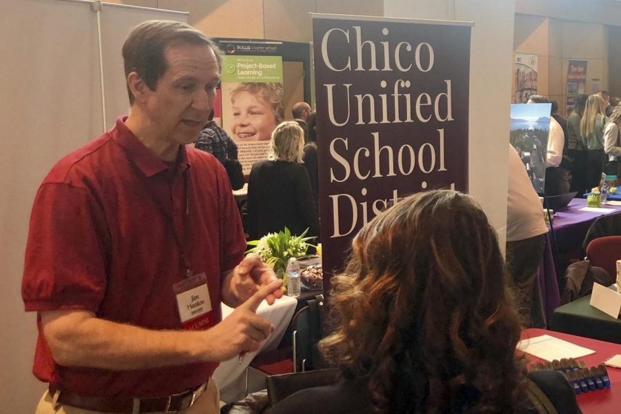 Jim Hanlon, Assistant Superintendent at Chico Unified School District, talks to students interested in finding a teaching job at the Education Hiring Fair in the Bell Memorial Union. Photo credit: Trenton Taylor