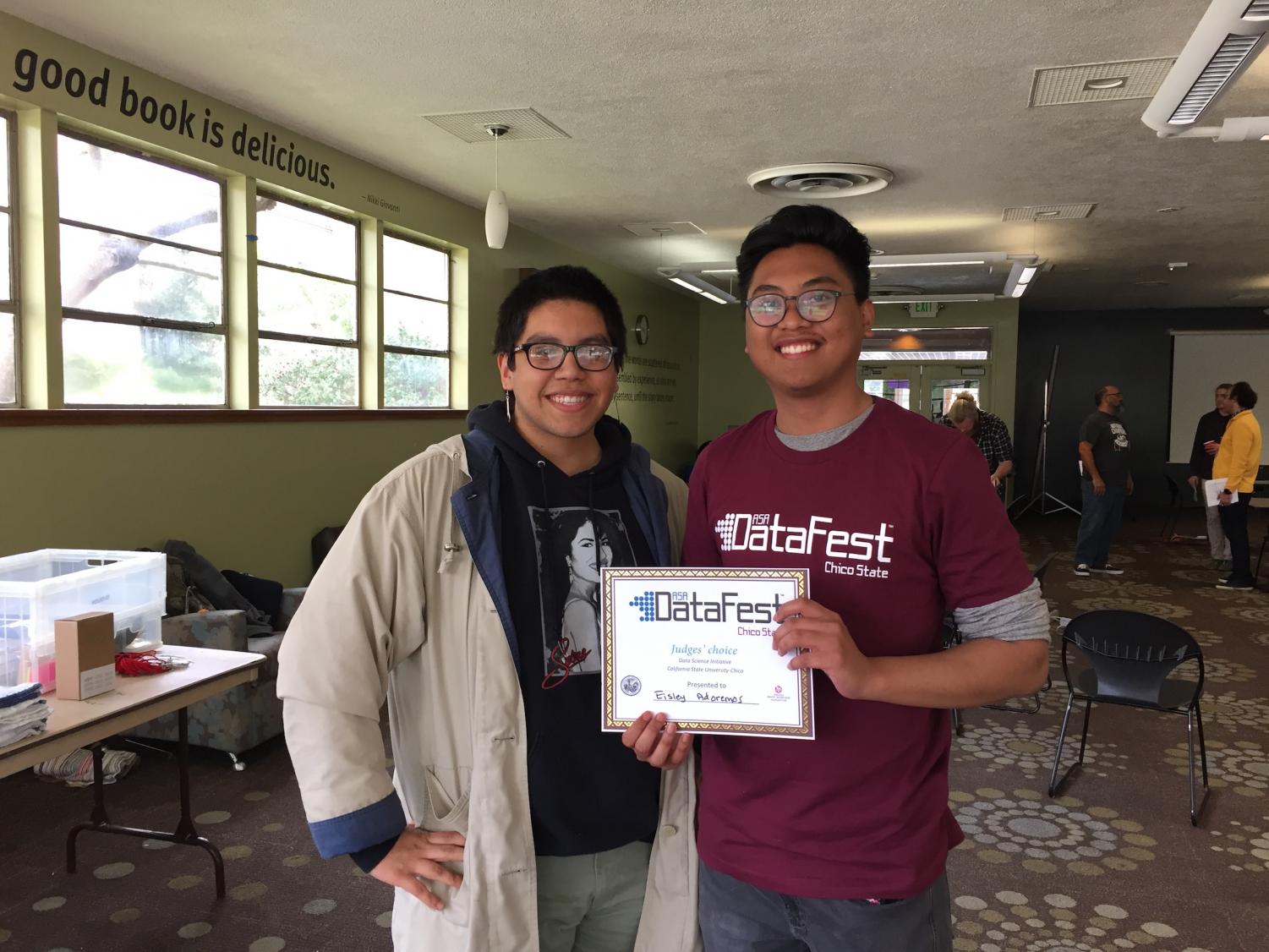 Chico State Students Eduardo Gomez (left) and Eisley Adoremos (right) showing their Judge's Choice award Sunday afternoon at the Data Fest competition at Sylvester's Cafe. Photo credit: Nate Rettinger