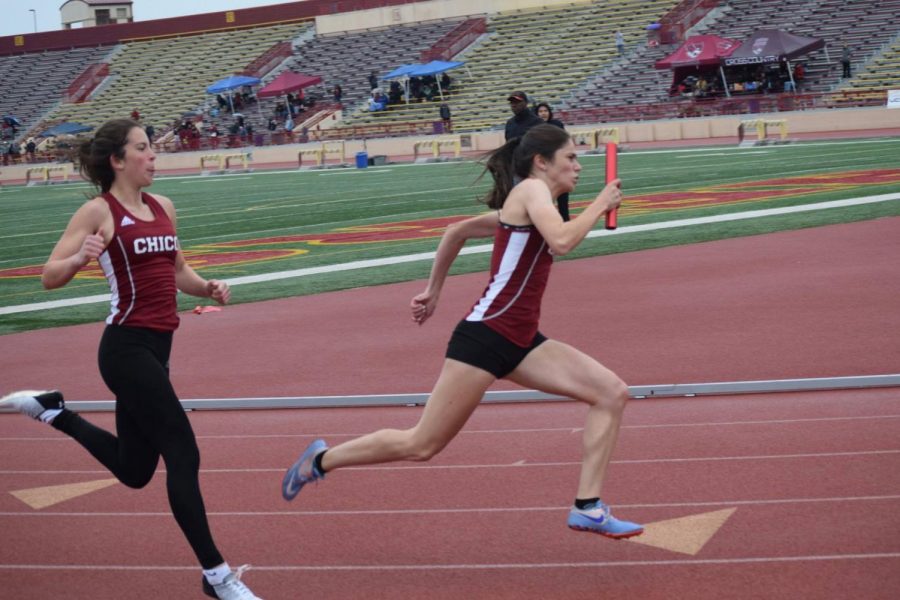 Isabella+Moyer+passing+on+the+baton+to+Lyndsey+Settle+in+the+invitational+track+meet+Sunday.+Image+courtesy+of+Chico+State+Sports+Information.