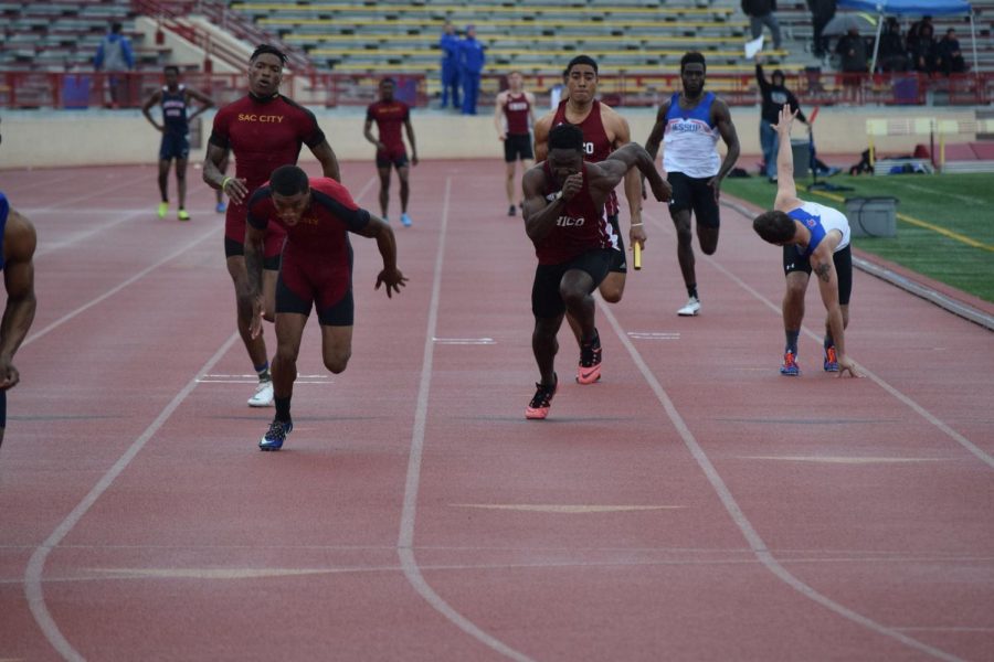 Joshua+Cummings+and+Isaiah+Roybal+running+a+medley+race+at+University+Stadium%2C+Photo+Courtesy+of+Sports+Information