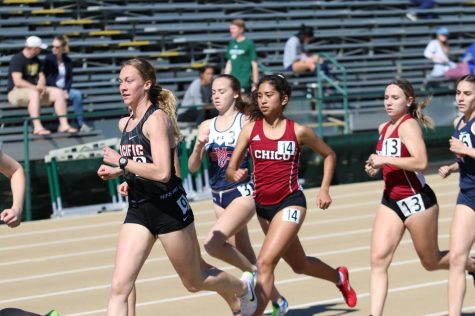 Distance runners Nadine Dubon and Taylor Bailey in the middle of competing. Image Courtesy of Gary Towne Photo credit: Gary Towne
