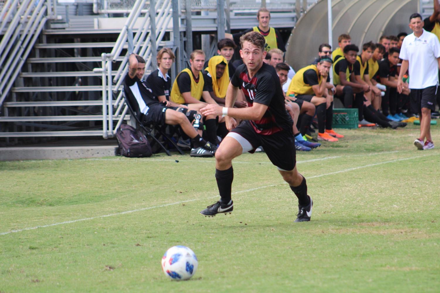 Joey Scotti recieving a pass down right sideline. Photo credit: Wesley Harris