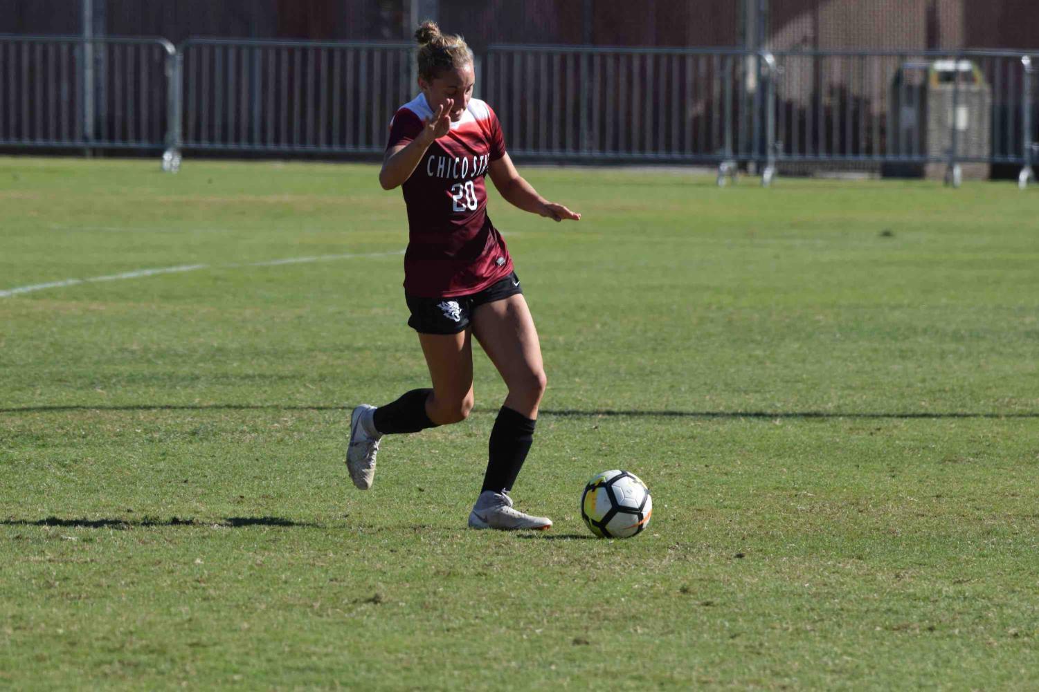 Jordan Doukakis having possession of the ball at home game. Photo Courtesy of Chico State Sports Information.