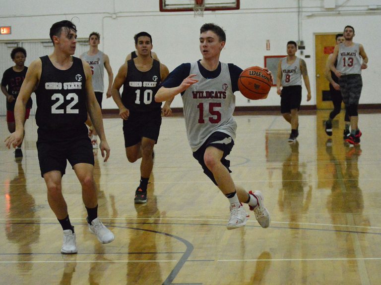 After a defensive steal, Marcus Rehrman charges down the court toward the basket with the defender, Peter Koenen, closely guarding during a scrimmage game on March 4, 2019. Photo credit: Olyvia Simpson