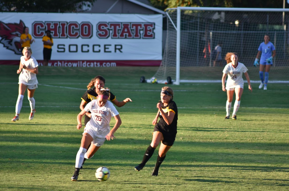 Chloe King outrunning the Dominican players on the field. Photo credit: Hana Beaty