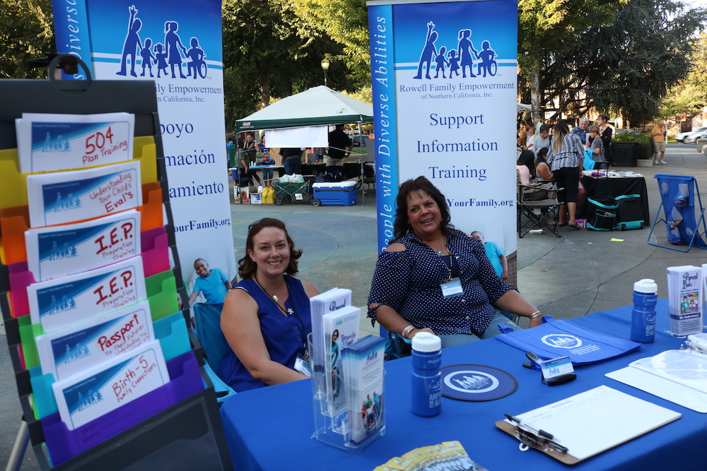 Rowell Family Empowerment (RFE) tabled at the event. They offered pamphlets, merchandise, support, training, and lots of information for locals. Photo credit: Mary Vogel