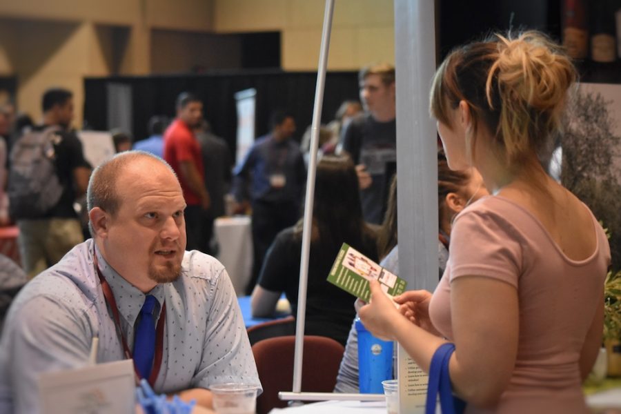 Students went to each booth and talked with recruiters about potential employments. Photo credit: Hana Beaty