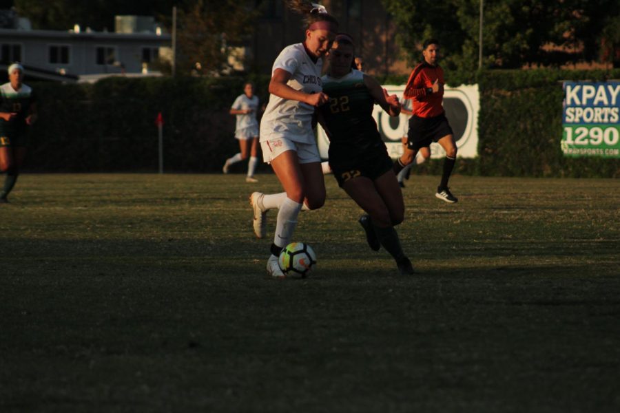 Alexi Vonsolos fights for ball against Cal Poly Pomona defender. Photo credit: Wesley Harris