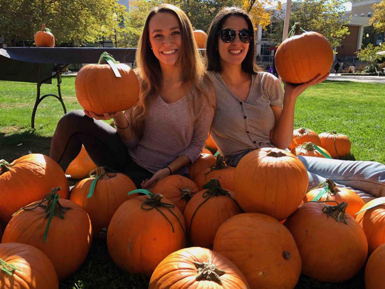 Abbey Linger (left) and Tania Enferadi (right) posing with their donated pumpkins. Donations came from Grocery Outlet, Lowe’s, Safeway and Books Family Farm. Photo credit: Emily Neria