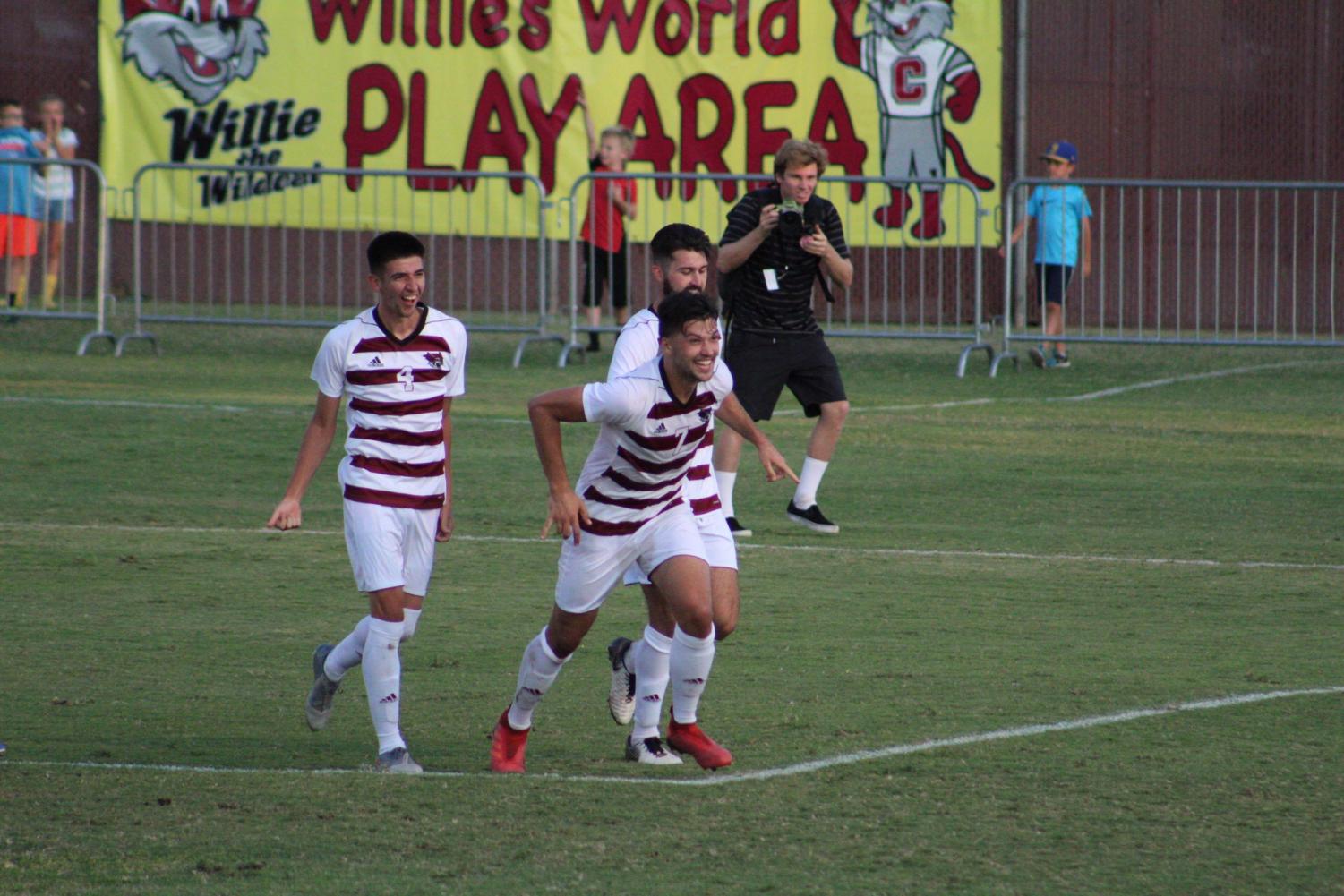 Ronan McEnroe (middle) celebrating a goal at University Soccer Stadium. Photo credit: Wesley Harris