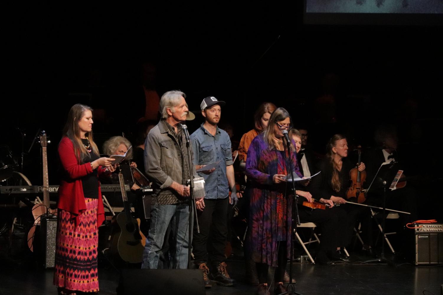 A creative ensemble singing and speaking about how people felt about the devastating fire. Photo credit: Hana Beaty