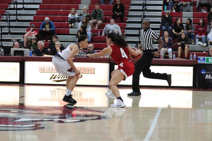 Chico player, Shay Stark and Holy Names player, Elle Burland, face off each other during the last ten minutes of the game. Photo credit: Melissa Herrera