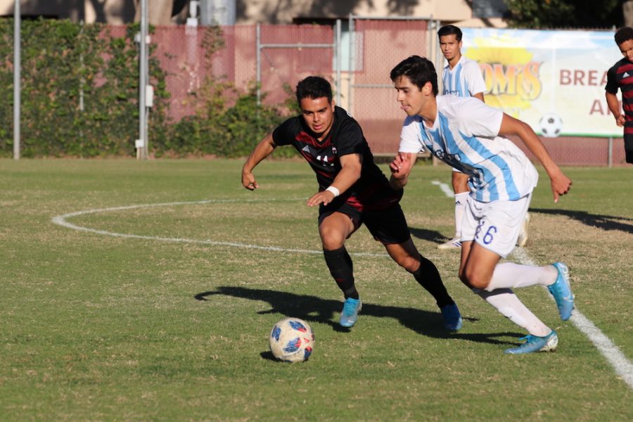 Chico State player, Cooper Renteria goes against Sonoma State player, Ulysses Vega to get the ball back. Photo credit: Melissa Herrera
