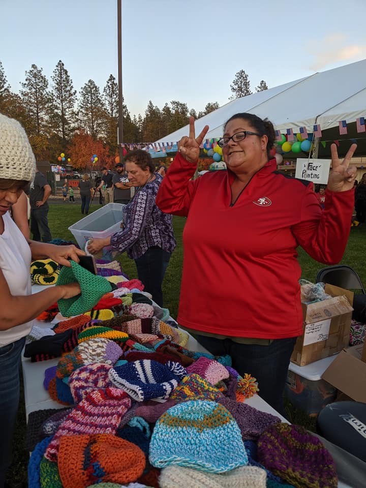 Quirarte spreading peace and love through beanies. Photo credit: Mimi Quirarte