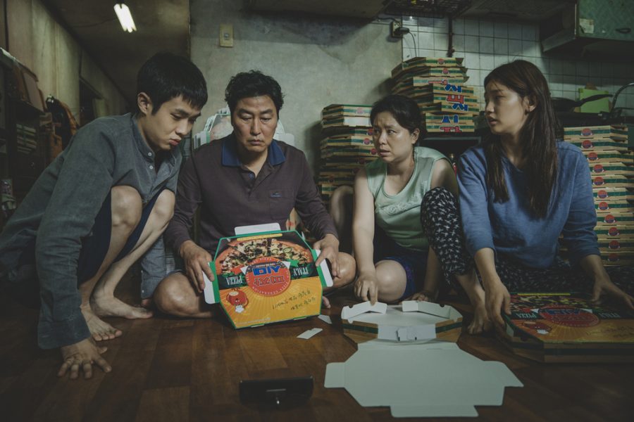 Left to right: Choi Woo-shik, Song Kang-ho, Jang Hye-jin and Park So-dam star as the impoverished Kim family in Parasite. 
Courtesy of NEON and CJ Entertainment.