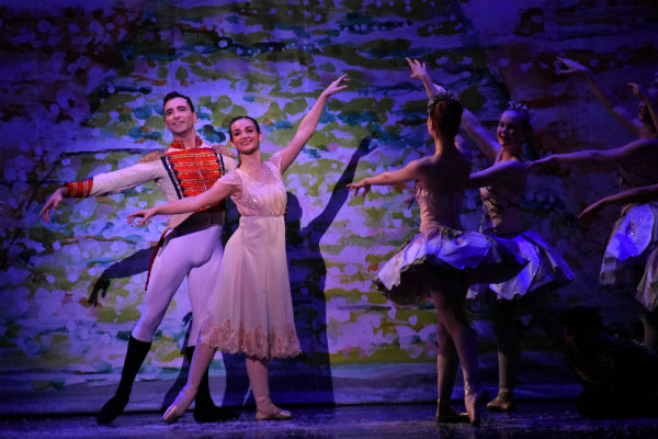 Angeline Stansbury (Adelaide Sands) and the Nutcracker Prince (Christopher B. Nachtrab) join the Almond Blossoms in dance. Photo credit: Rayanne Painter