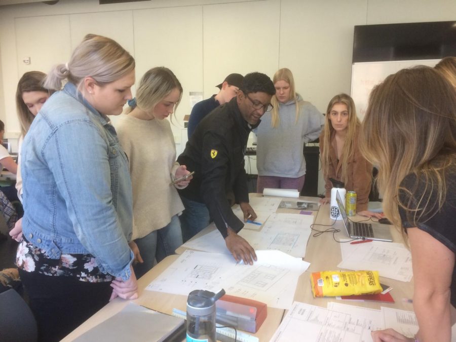 Rouben Mohiuddin instructs a circle of Chico State Architecture students in class. Photo by Emily Neria