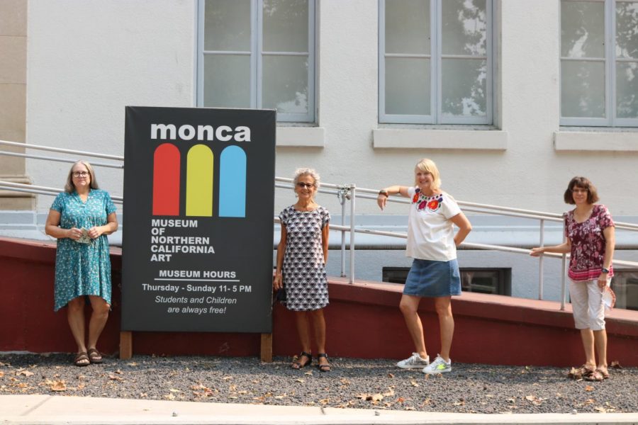 Three of the artists featured in the exhibit pose with the Moncas executive director, Pat Macias. [pictured left to right: Kandis Horton-Jorth, Pat Macias, Reta Rickmers, Penni Baxter.]