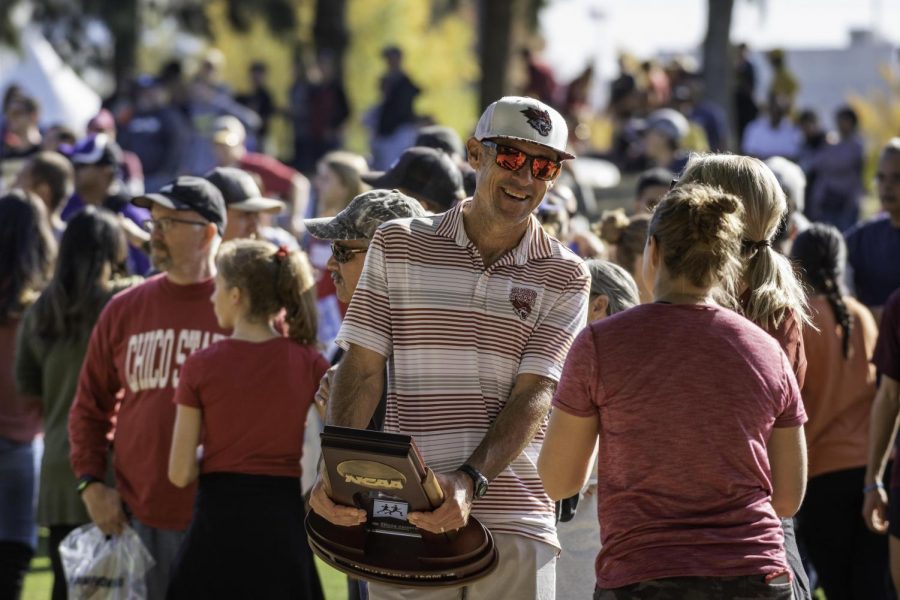 Coach Gary Towne (center) talks to fans after the Chico State Wildcats compete in the mens 2019 NCAA Division II Cross Country Championships at Haggin Oaks Golf Course on Saturday, November 23, 2019 in Sacramento, Calif.