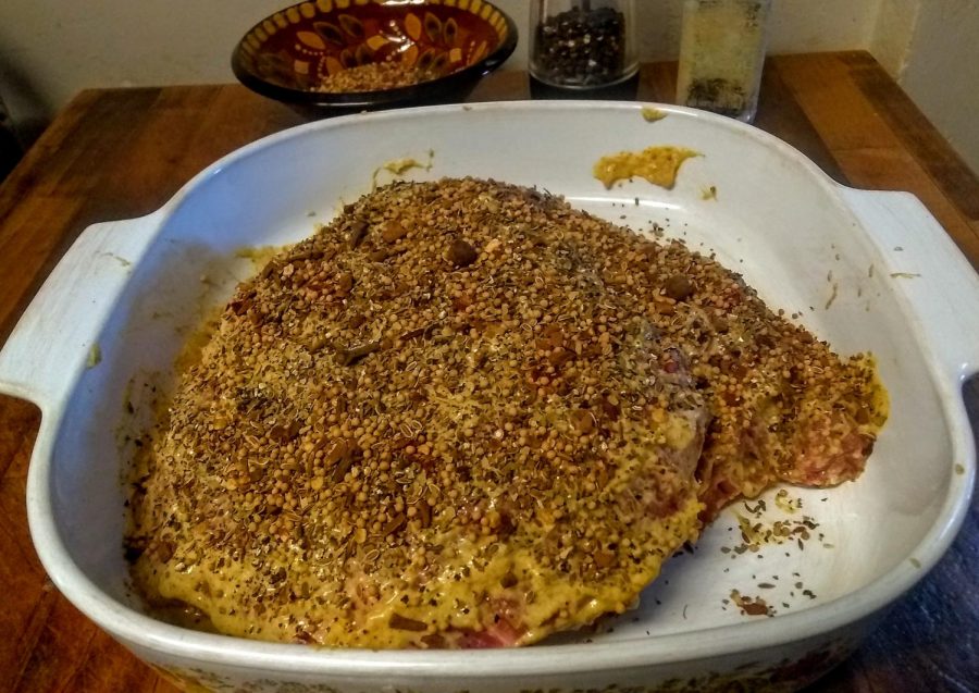 Cover that beef! 4 pounds of corned beef slathered in mustard, pickling spice, salt and pepper, ready to cook.
