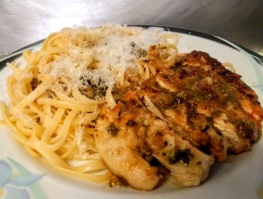 Chicken piccata on garlic butter pasta, topped with lemon juice and parmesan. Photo by Ian Hilton, 5/6/2021.