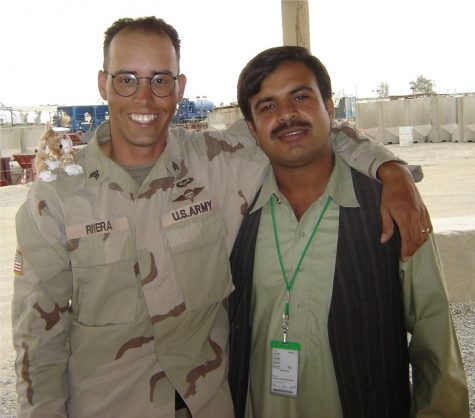 Oscar Rivera (left) pictured with interpreter Masud (right) during Riveras service in Afghanistan. Photo courtesy of Oscar Rivera, 2005.