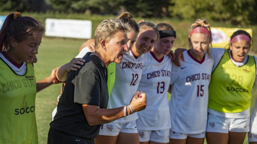 Chico State Wildcats head coach Kim Sutton (center) encourages the team against Dominican Penguins during the second half of their women's soccer game on Thursday, September 12, 2019 in Chico, Calif. 