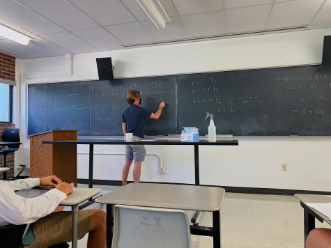 Photo taken by Aldo Perez. Professor John Lind teaches an upper-division math class during the Fall 2021 semester. Note the in-person teaching and the use of masks. 