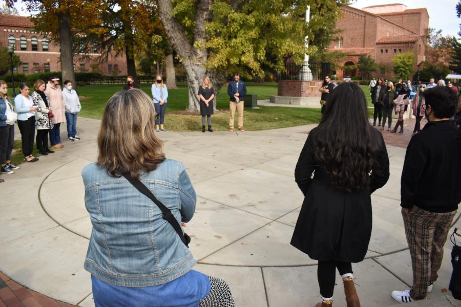 A crowd was gathered in front of Kendall Hall for a moment of silence to remember the Camp Fire on Nov. 8.