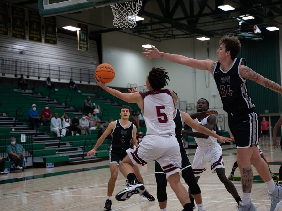 Guard Isaiah Brooks attempts a reverse layup against SPU