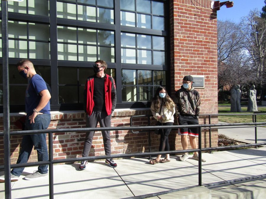 Students line up outside of Colusa Hall and wait for their turn for a COVID test.