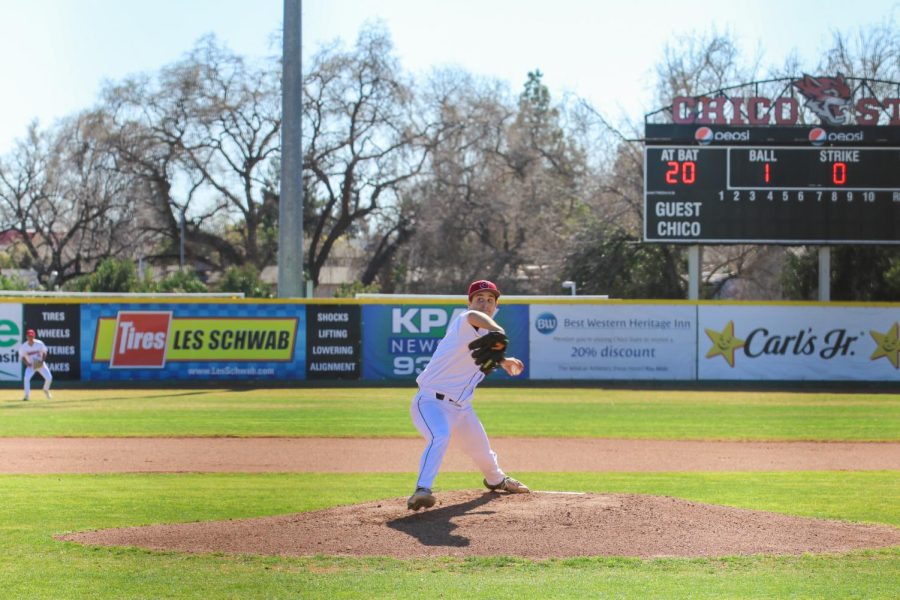 On the mound, sophomore Cody Gentry is in pitching motion ready to throw a pitch to the Red Hawks batter. Gentry pitched six innings and allowed five runs.