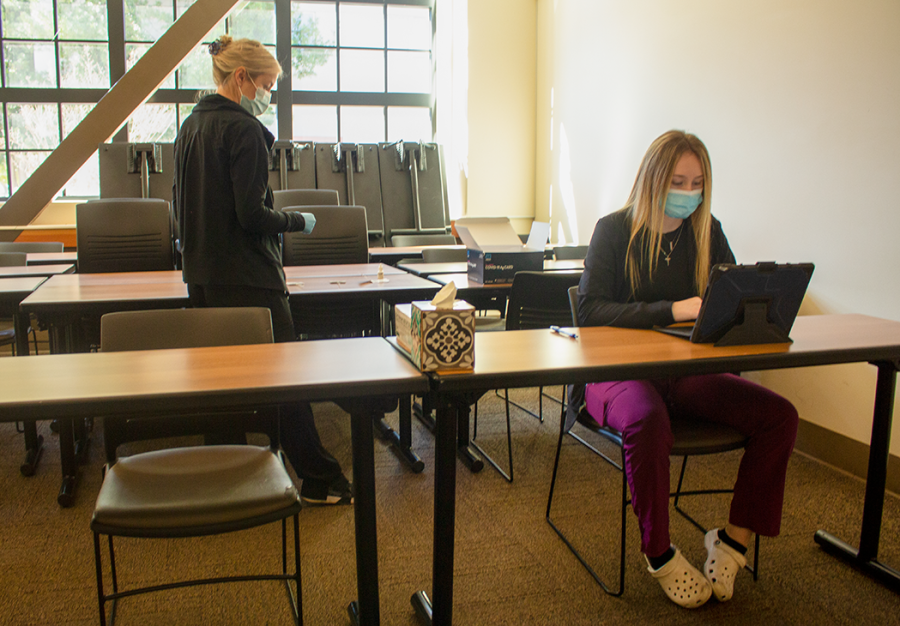 Testing site leads, Kristi Ray (left) and Savannah Kirk (right) waiting for patients to enter the testing room at the Colusa Hall testing site on Feb. 10.