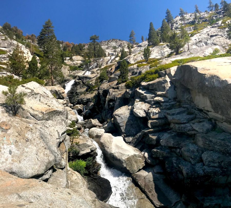View of granite slabs, waterfall, and forests at Horsetail Falls, CA