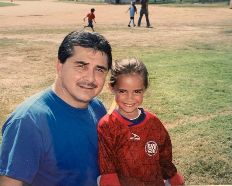 Young Cassi Tejeda and her grandfather Paul on a soccer field