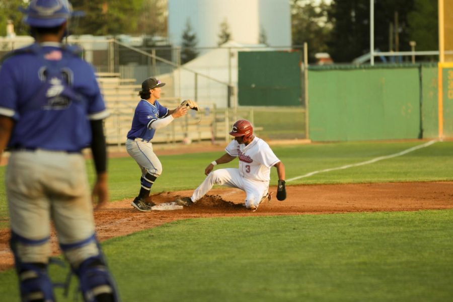 On March 25, 2022. sophomore shortstop Elijah Jackson slides into third base off of a sacrifice fly. The Wildcats defeated the Cougars 18-4 at Nettleton Stadium. Jackson went 3 for 3 at the plate.
