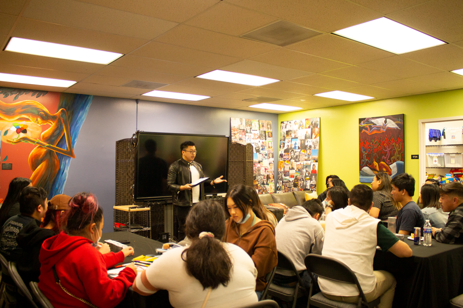 Kenji Lo presenting his essay at the final Hmong Legacy on April 21.