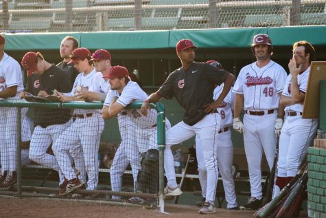 On March 25, a group of Wildcat players looks toward the field as they play the San Marcos Cougars at Nettleton Stadium winning 18-4.