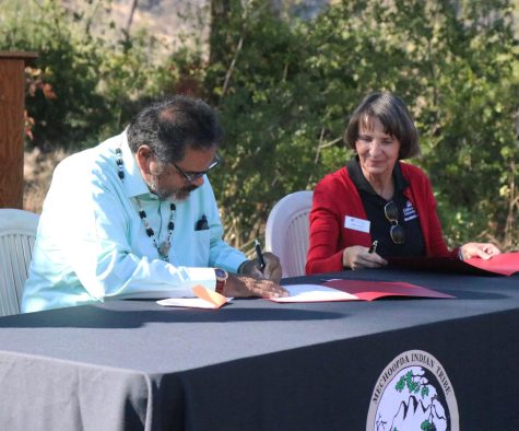 Chairman Dennis Ramirez and Chico State Provost Debra Larson signing documents at the end of the transfer ceremony. Photo by Noah Herbst, taken Sept. 23.