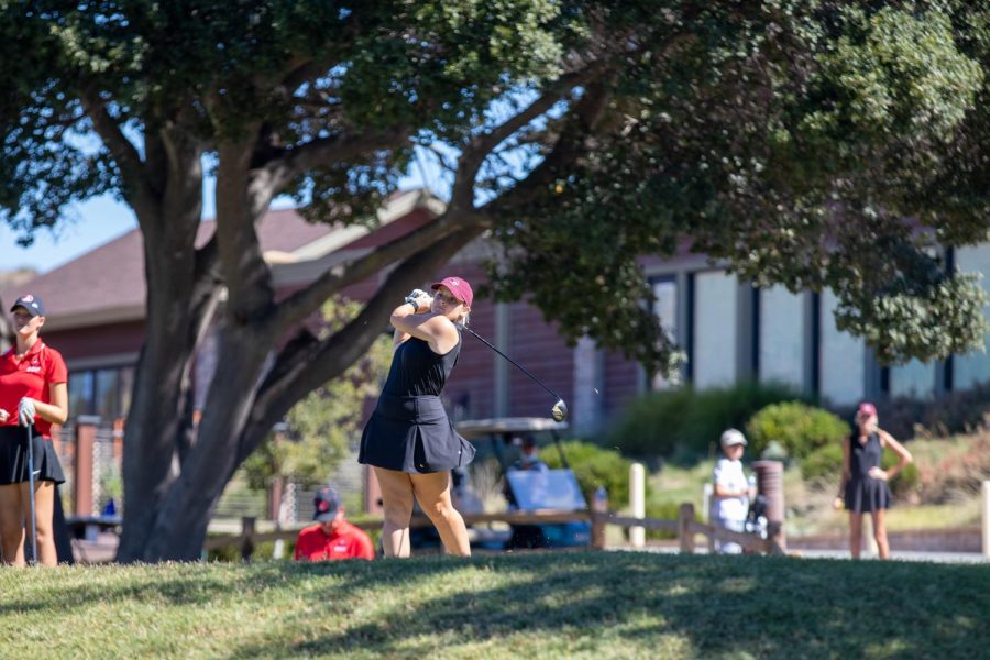 At the top of the tee box, Keely More uses her driver to hit her ball into the fairway. Photo captured by Chico State Sports Information.